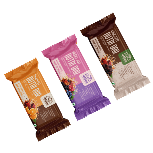 Three packaged protein bars from Protein Bar India arranged diagonally on a plain white background. The bars are individually wrapped in colorful foil packaging: orange-brown, pink-purple, and dark brown with cream sections.