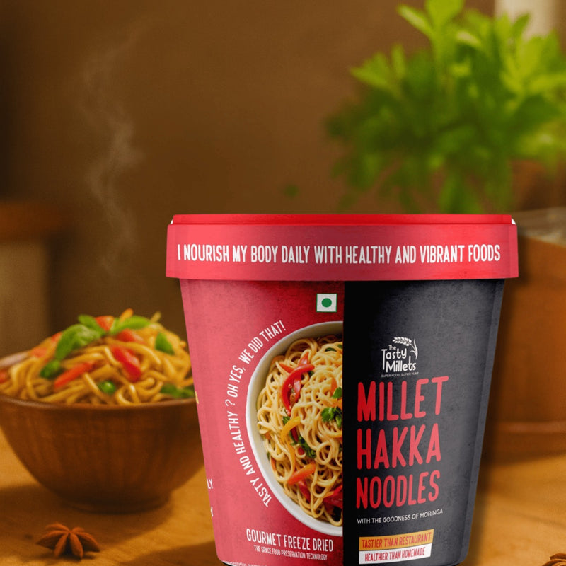 Millet Hakka Noodles container with a bowl of noodles and vegetables in the background