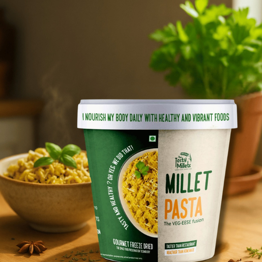 Millet pasta container with a bowl of pasta and a plant in the background