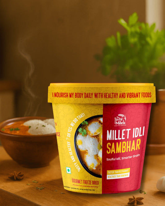 Container of Millet Idli Sambhar with a bowl of food in the background