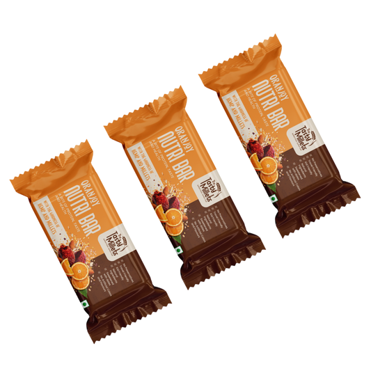 Three individually wrapped Nutri Bar granola bars arranged diagonally on a plain white background. The packaging features a bright orange top half with white text and a dark brown bottom half, decorated with illustrations of fruit ingredients like oranges, berries, and bananas.