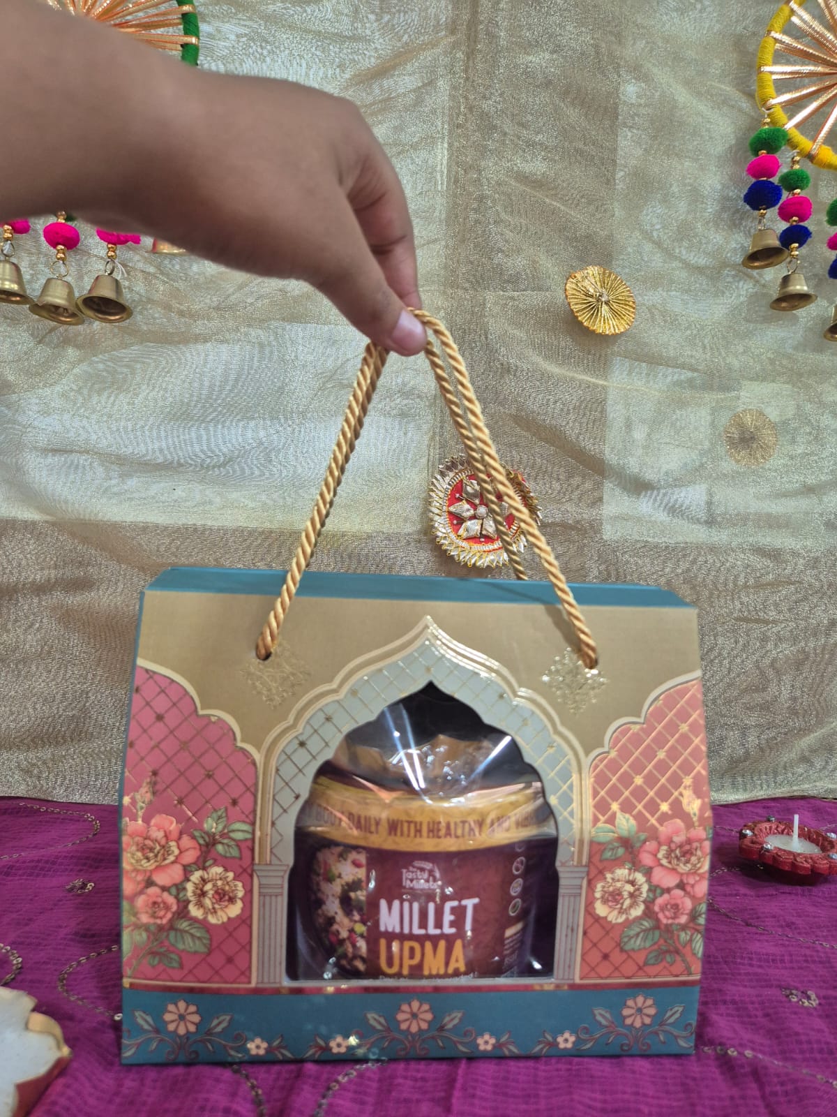 Festive millet gift hamper with candle and gift box