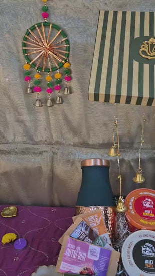 A  Festive gift Hamper which comes with 2 millet meals, 3 nutri bars and single dark teal bottle